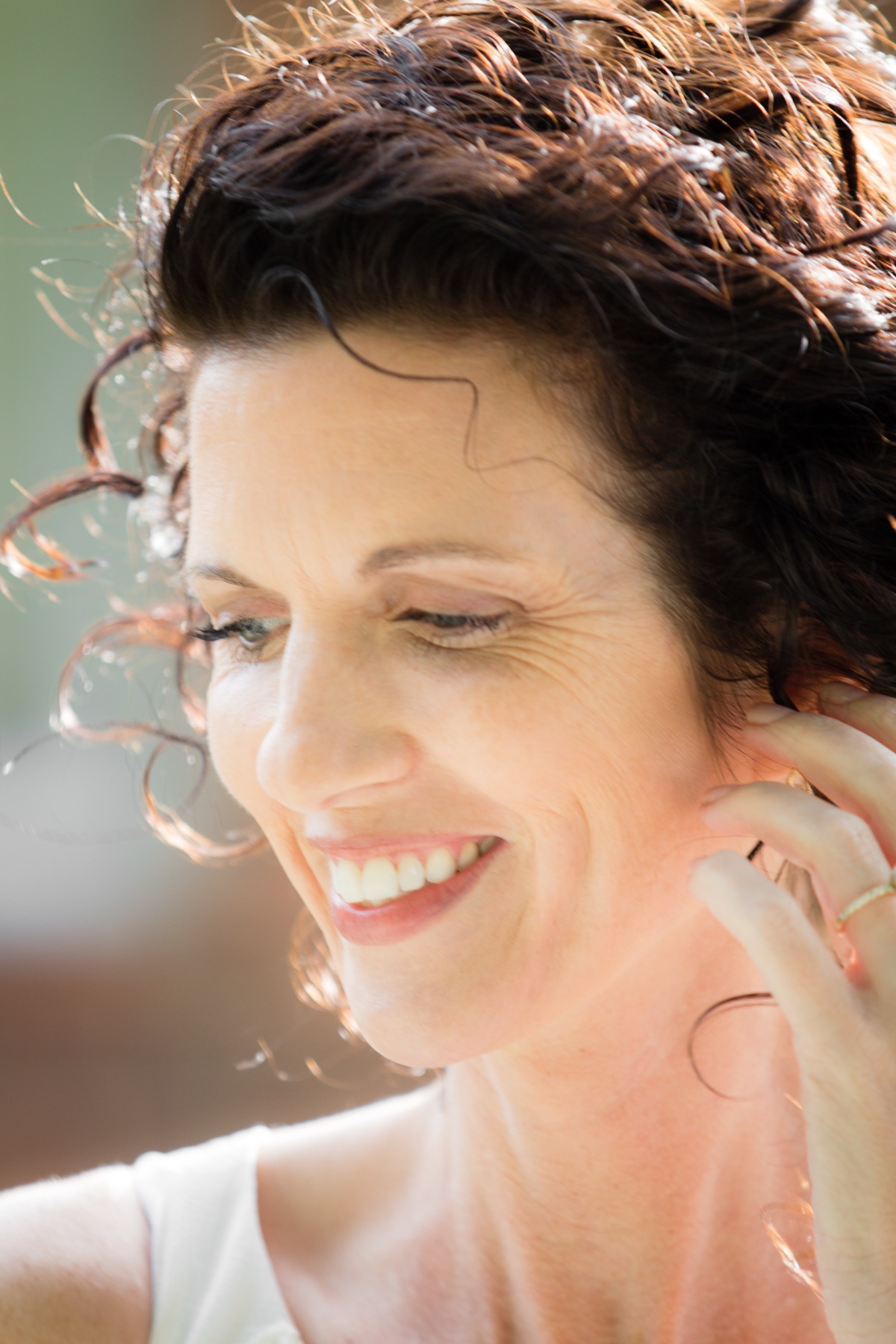 Candid portrait of a woman laughing in natural light